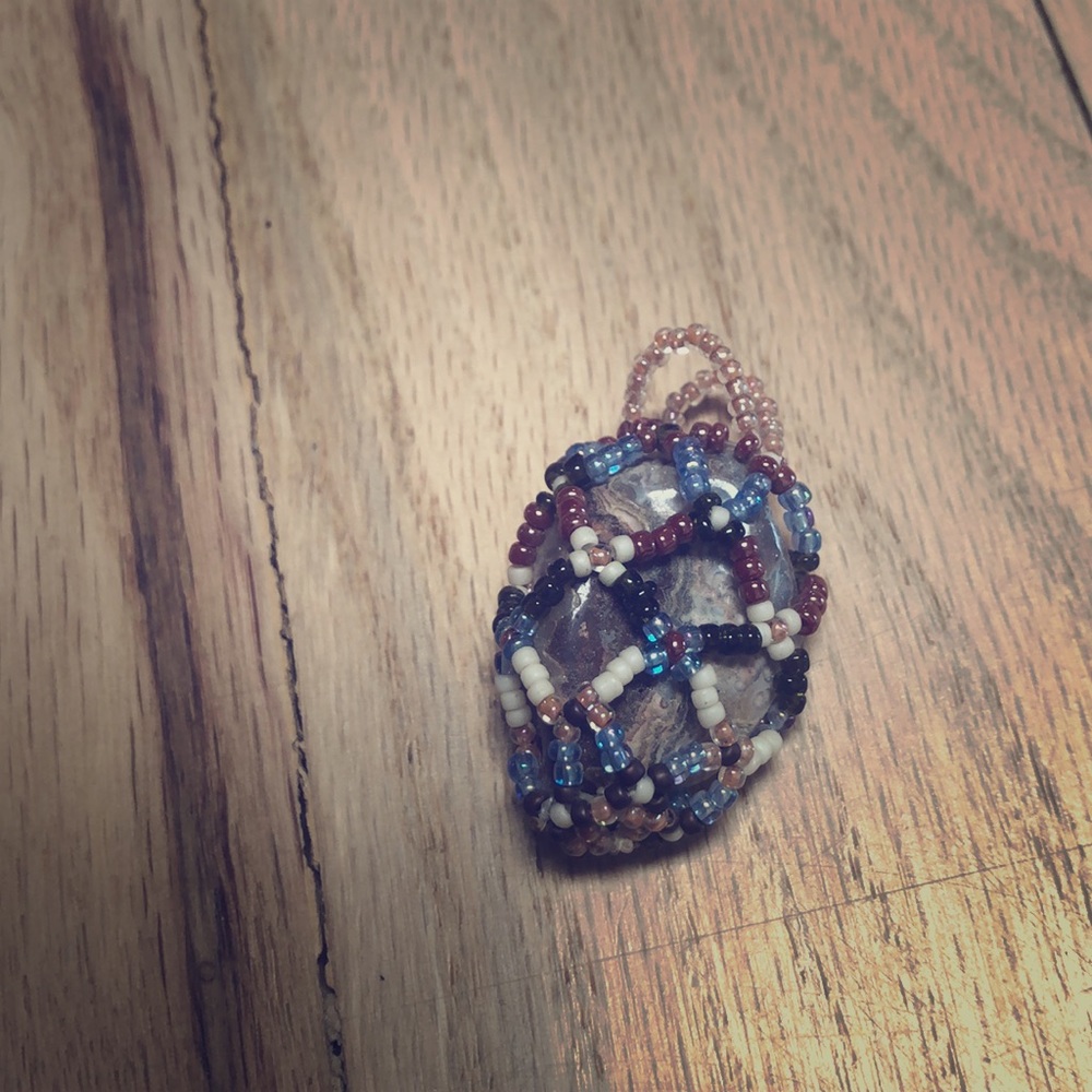 Beaded rock pendant.